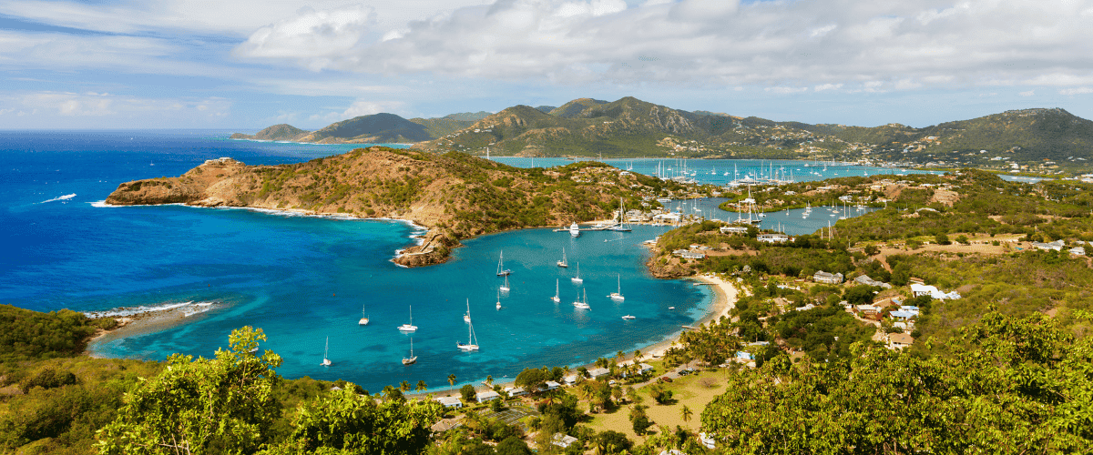 Overhead view of a caribbean island with blue water and mountains