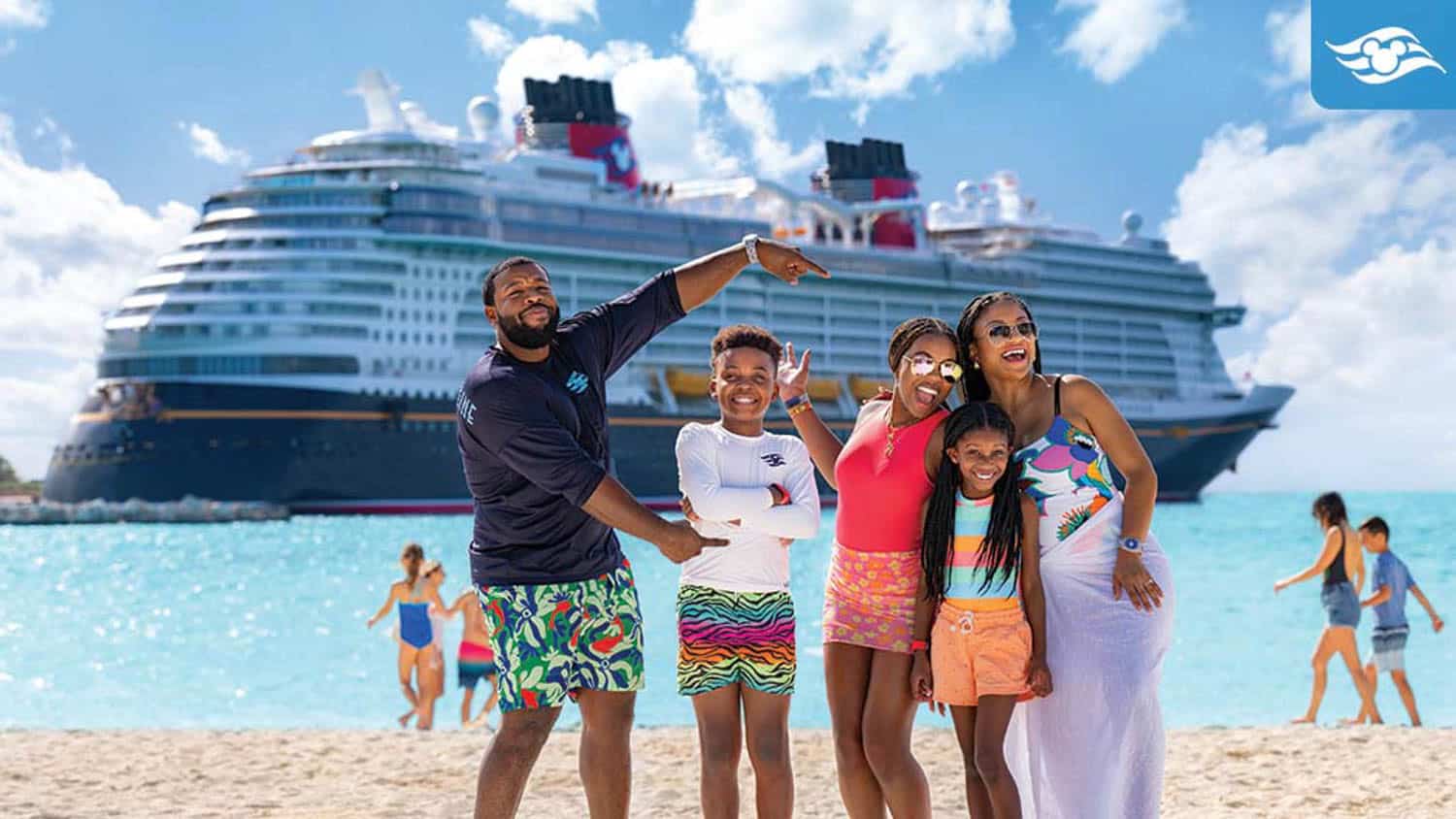 Anna-Swenson-11 A family of five poses and smiles on a beach with a large cruise ship docked in the background.